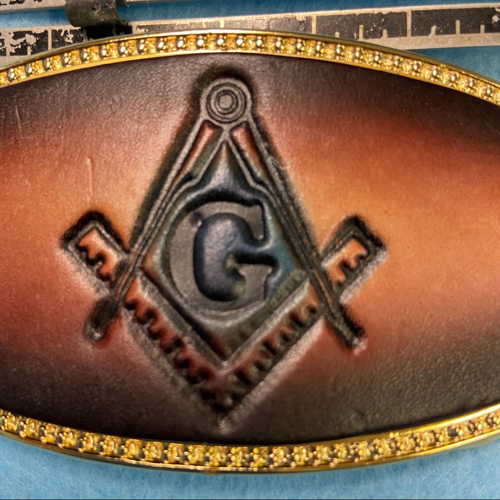 Mason Symbol stamped and painted into Leather and attached to ALUMALINE buckle